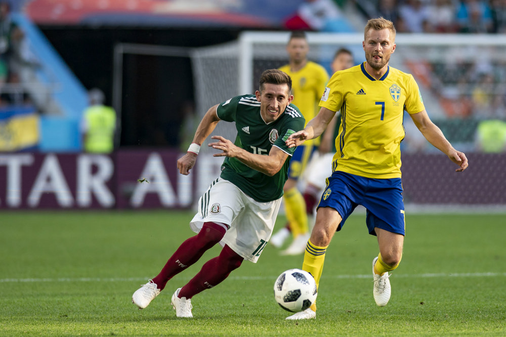 Mexico advance despite loss to Sweden