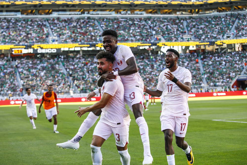 Shehata header powers Qatar past Mexico and into QFs